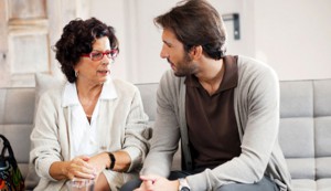 Senior adult woman talking to her son.