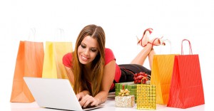 Beautiful young woman shopping over internet